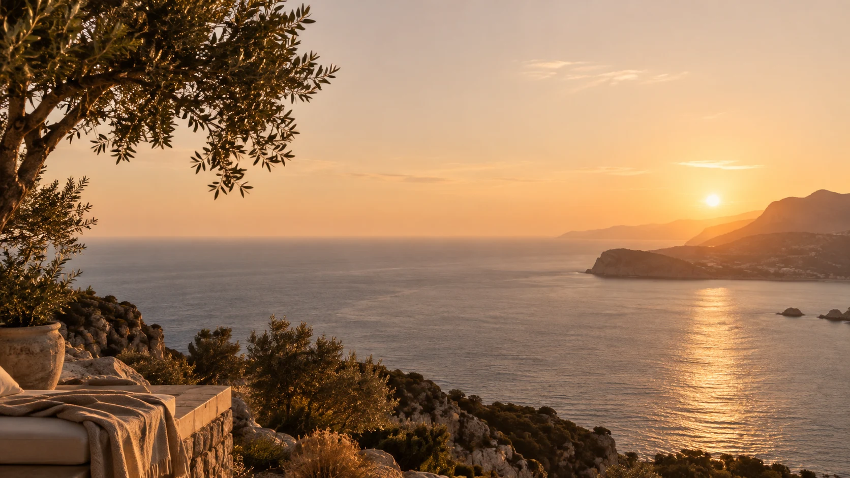 Golden evening light over the sea and coastal hills